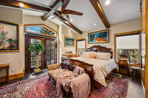 Bedroom with lofted ceiling, access to exterior, dark wood-style floors, recessed lighting, and ceiling fan