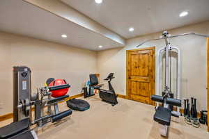 Exercise area featuring recessed lighting and carpet