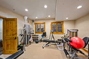Exercise area with recessed lighting and carpet floors