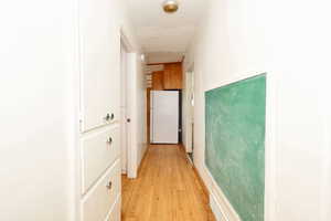 Hallway featuring light wood-type flooring