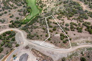Aerial view of property's location with property parcel outlined and rural landscape