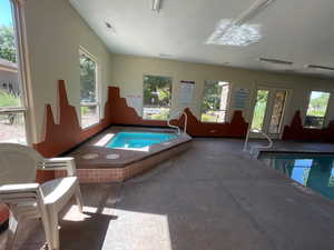 Community pool with a hot tub