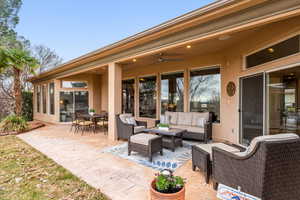 View of patio / terrace featuring outdoor lounge area, ceiling fan, and a sunroom