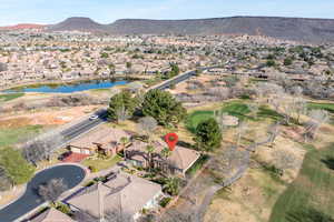 Aerial perspective of suburban area featuring a water and mountain view and a golf club