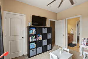 Sitting room featuring light colored carpet