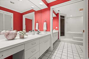 Bathroom featuring vanity, a stall shower, light tile patterned floors, crown molding, and recessed lighting