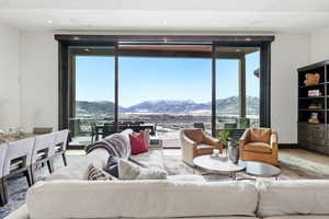 Living area featuring a mountain view, wood finished floors, plenty of natural light, and recessed lighting
