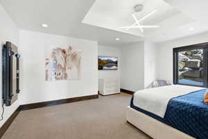 Carpeted bedroom with recessed lighting