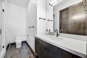 Bathroom featuring vanity and a shower stall