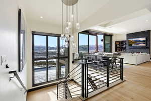 Stairway featuring recessed lighting and wood-type flooring