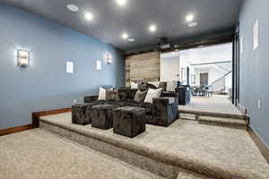 Cinema with carpet floors and recessed lighting