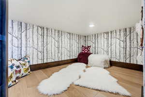 Bedroom featuring recessed lighting and wood finished floors