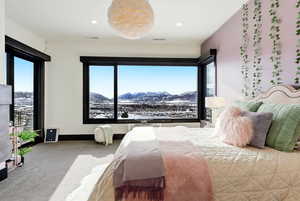 Carpeted bedroom featuring a mountain view and recessed lighting
