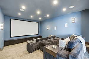 Cinema featuring light carpet and recessed lighting