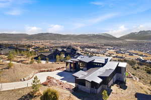 Aerial perspective of suburban area featuring a mountain backdrop