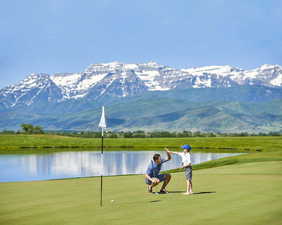 View of community featuring a water and mountain view