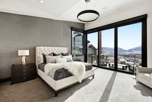 Bedroom featuring a mountain view, light colored carpet, and recessed lighting