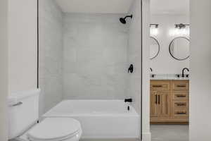 Bathroom with double vanity and shower / washtub combination