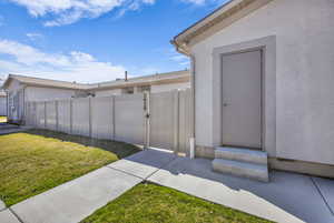 View of yard featuring a gate and entry steps