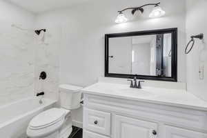 Bathroom featuring shower / bathtub combination and vanity