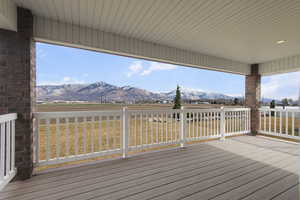 Wooden deck featuring a mountain view