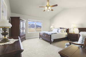 Bedroom featuring a mountain view, light colored carpet, vaulted ceiling, and ceiling fan