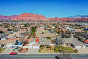 Aerial perspective of suburban area with a mountain backdrop