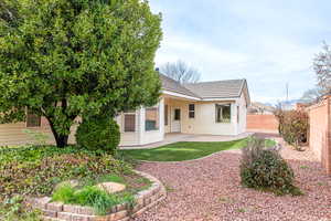 Rear view of property with a patio area and a fenced backyard