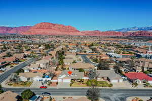 Aerial perspective of suburban area featuring a mountainous background