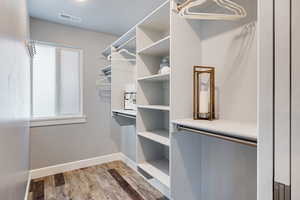 Walk in closet featuring light wood-type flooring