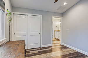 Unfurnished bedroom with a closet, light wood-style floors, ceiling fan, and recessed lighting