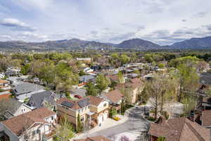 Aerial perspective of suburban area featuring a mountain backdrop