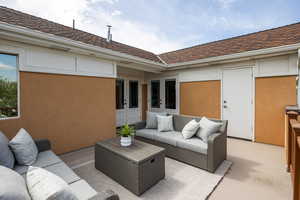 View of patio with an outdoor lounge area and french doors