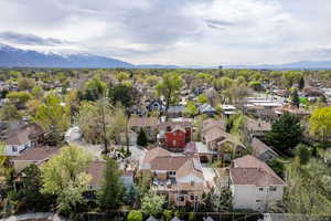 Aerial perspective of suburban area with a mountainous background