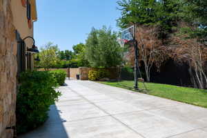 View of patio featuring a gate