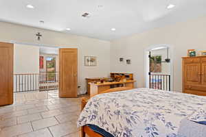 Bedroom featuring multiple windows, recessed lighting, and light tile patterned floors