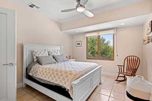 Bedroom featuring light tile patterned floors, ceiling fan, and recessed lighting