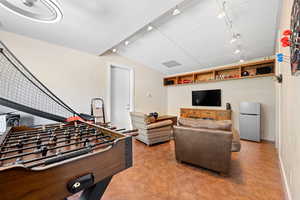 Recreation room with rail lighting