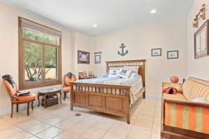 Bedroom featuring light tile patterned flooring and recessed lighting