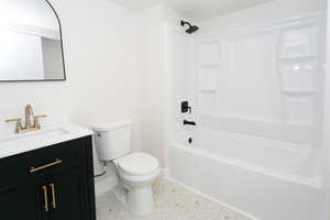 Bathroom featuring vanity and shower / tub combination