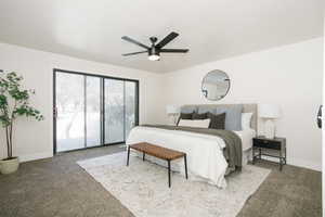 Carpeted bedroom with a ceiling fan and access to outside