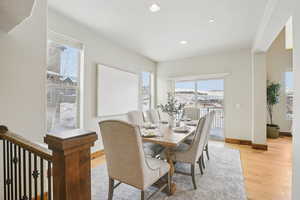 Dining area featuring light wood-style floors and recessed lighting