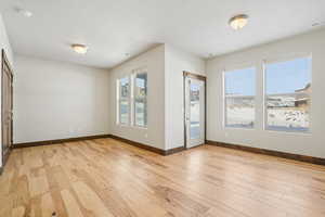 Unfurnished room featuring light wood-style floors