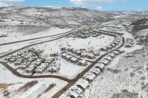 Snowy aerial view featuring a mountain view