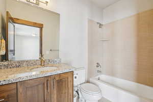 Bathroom featuring vanity and  shower combination