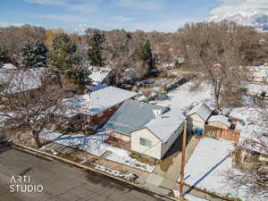 Snowy aerial view featuring a residential view