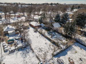 Snowy aerial view featuring a residential view