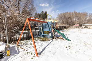 Snow covered playground with a playground