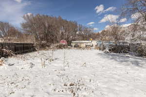 View of yard covered in snow