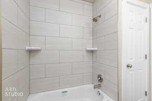 Full bathroom with tub / shower combination